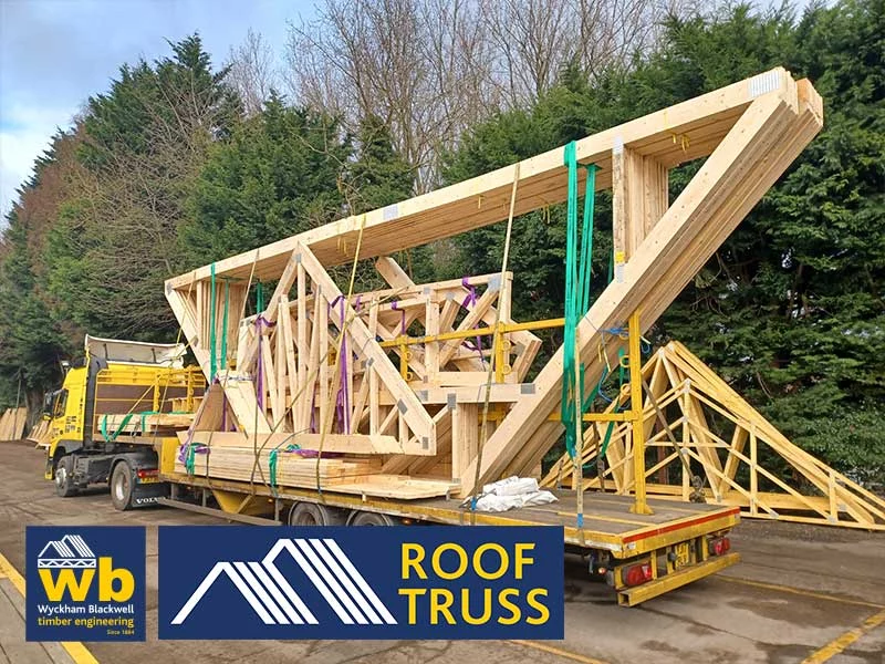 Timber roof trusses on back of flat bed lorry